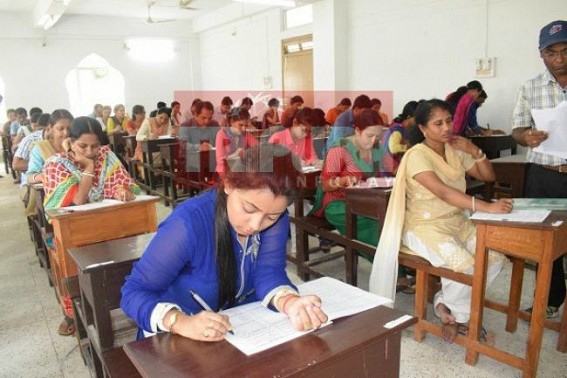 Job aspirants sit in Teachers' Test exam